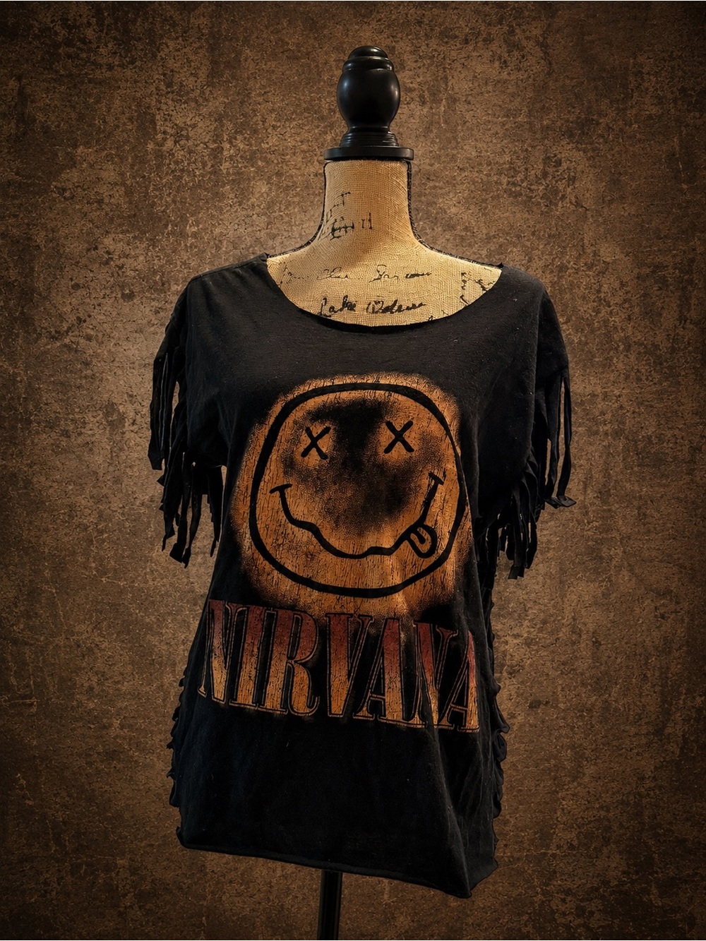 NIRVANA Black Short-Sleeve Fringe Tee with Orange Smiley Graphic